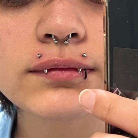 angel bites piercing|vertical angel fangs piercing.